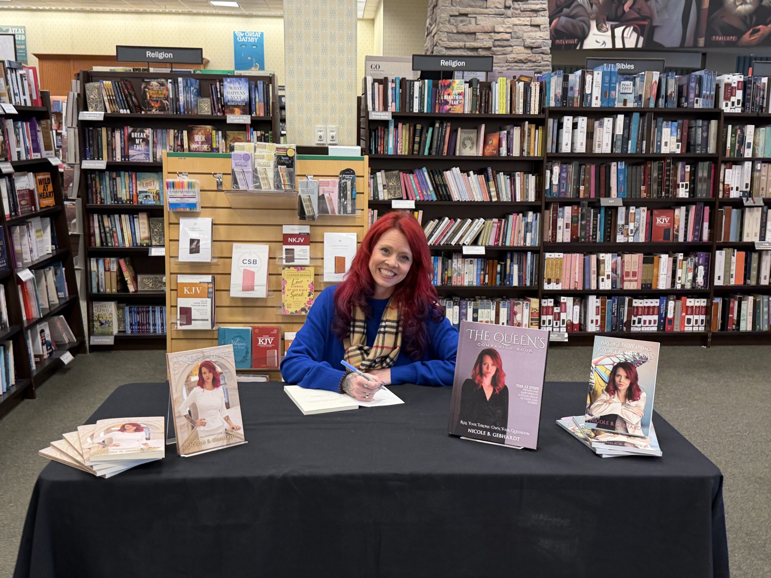 image of Nicole signing the book